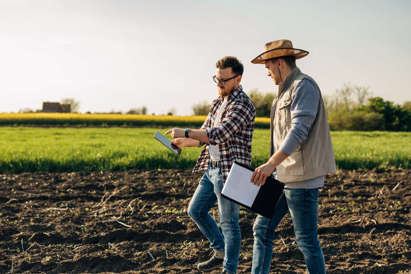 Farmers walking in field