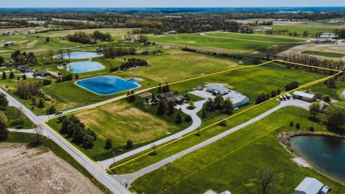 10 +/- Acres with Spacious Home & Multiple Outbuildings